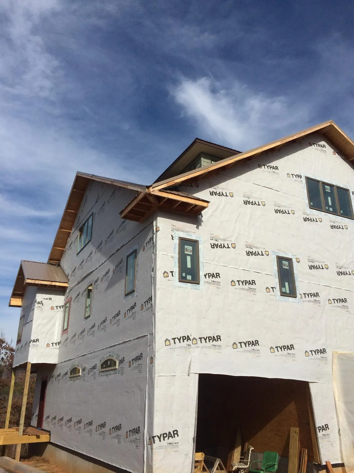 Stick built house wrapped in Typar with new roof framing and dormers in Freeport